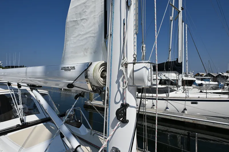 Slide: The Image of 2024 Tartan 395 sailboat with Leisure Furl system, docked in a marina under clear blue skies. - 35