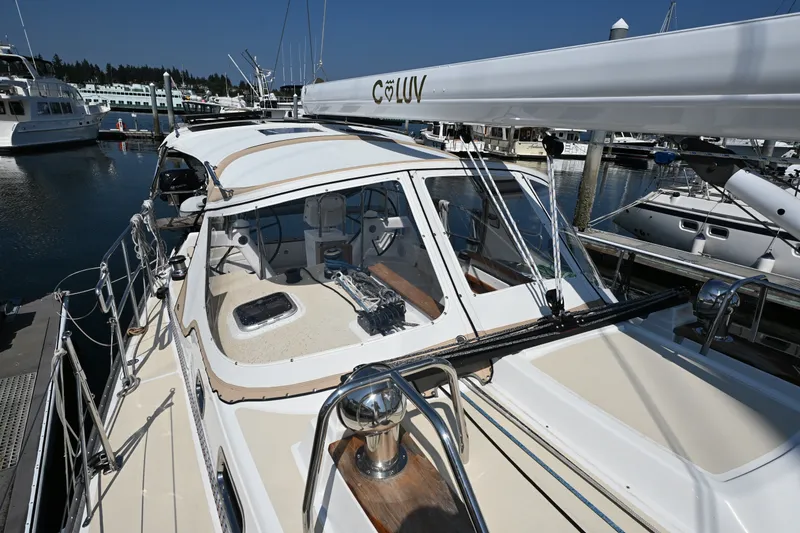 Slide: The Image of 2024 Tartan 395 sailboat docked at marina, showcasing sleek design and modern features. - 36