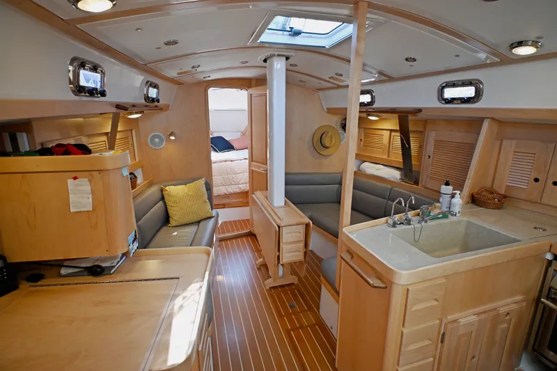 Slide: The Image of Luxurious 2024 Tartan 395 yacht interior with modern kitchen and cozy seating area. - 2