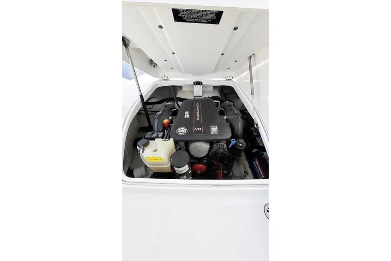 Slide: The Image of Engine compartment of a 2013 Chaparral 287 SSX boat, showcasing the Volvo Penta V8 engine. - 32