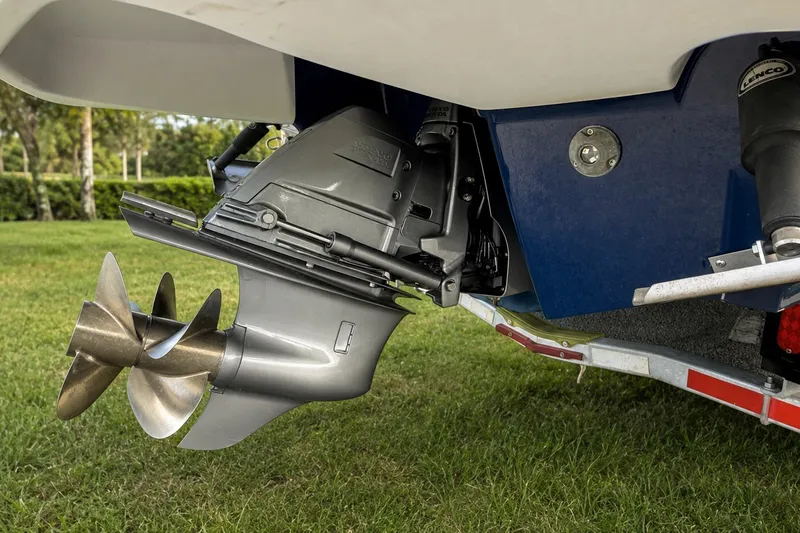 Slide: The Image of 2013 Chaparral 287 SSX boat propeller and stern drive on grass. - 14
