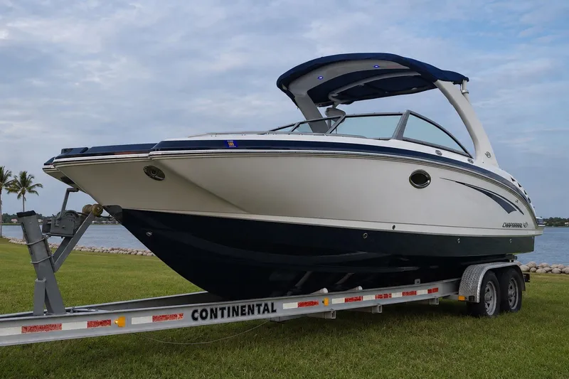 Slide: The Image of 2013 Chaparral 287 SSX boat on trailer by the water. - 11