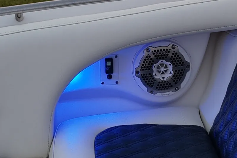 Slide: The Image of 2013 Chaparral 287 SSX boat interior with speaker and blue LED lighting. - 26