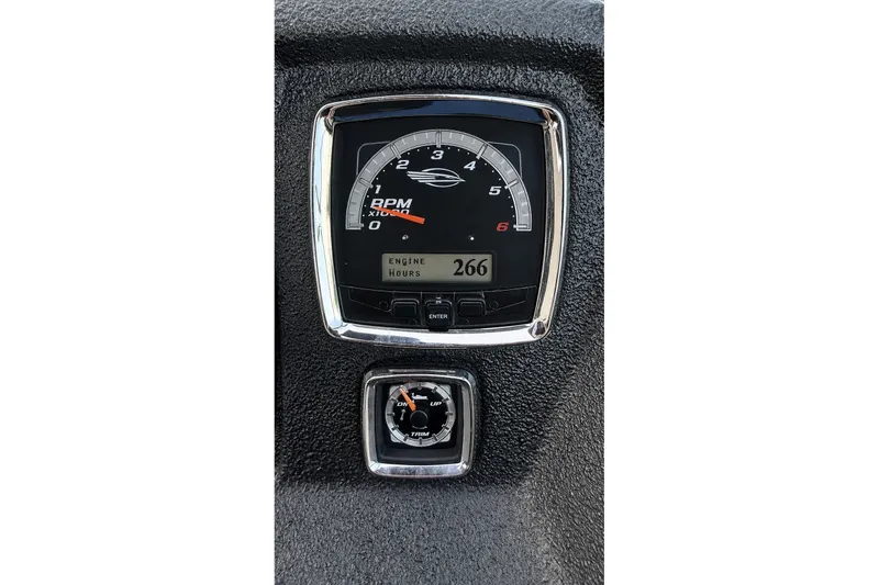 Slide: The Image of Dashboard of 2013 Chaparral 287 SSX showing RPM gauge and engine hours. - 30