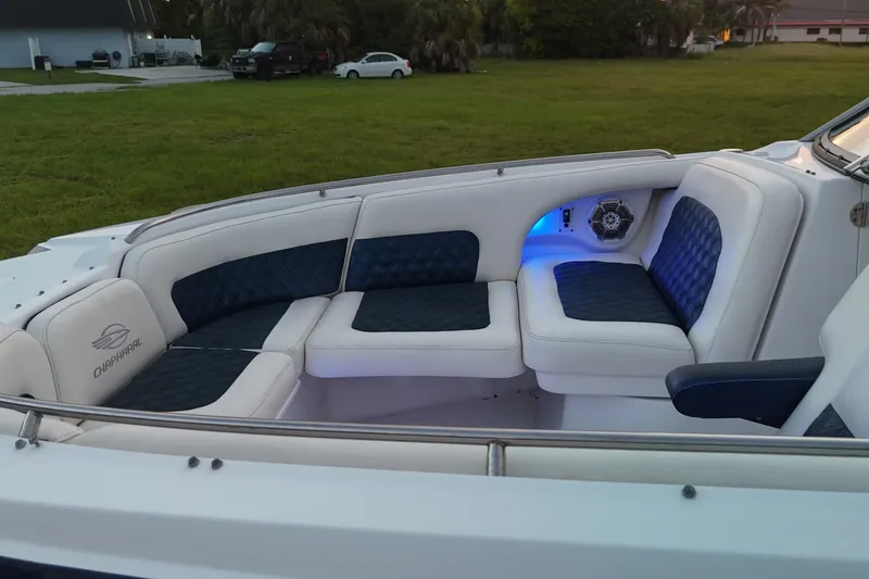 Slide: The Image of 2013 Chaparral 287 SSX boat interior with blue and white seating. - 25