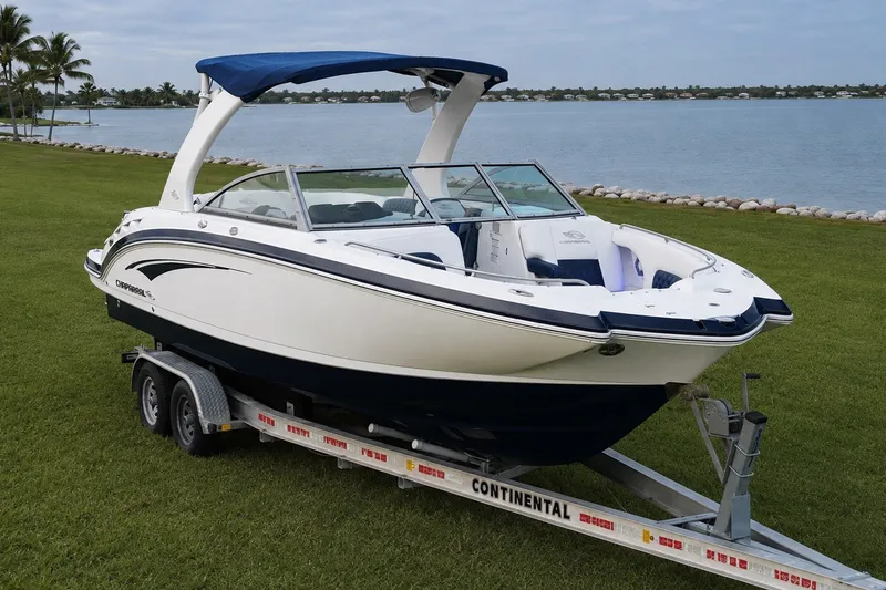 Slide: The Image of 2013 Chaparral 287 SSX boat on trailer by a scenic lakeside. - 12