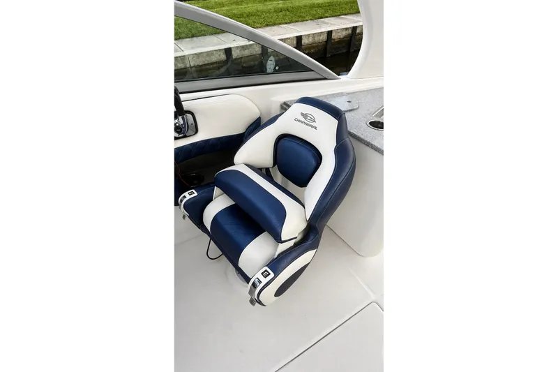 Slide: The Image of Luxury seating on 2013 Chaparral 287 SSX boat, featuring blue and white upholstery. - 23