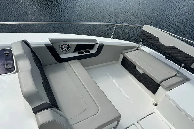 Slide: The Image of Luxurious seating area on 2023 Aquila 36 Sport boat, featuring elegant upholstery and speaker system. - 6