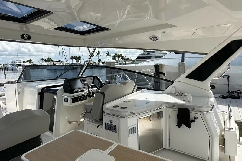 Slide: The Image of Interior view of 2023 Aquila 36 Sport yacht with modern helm and seating area. - 17
