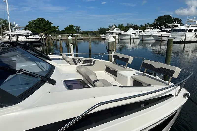 Slide: The Image of 2023 Aquila 36 Sport yacht docked at a marina with clear skies. - 5
