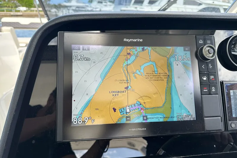 Slide: The Image of Raymarine navigation display on 2023 Aquila 36 Sport, showing Longboat Key map. - 11