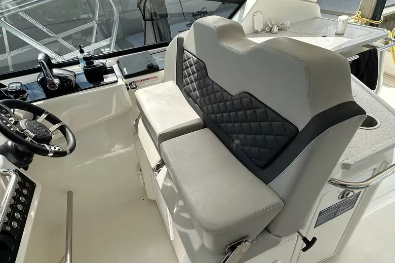 Slide: The Image of 2023 Aquila 36 Sport helm with dual seats and modern steering wheel. - 13
