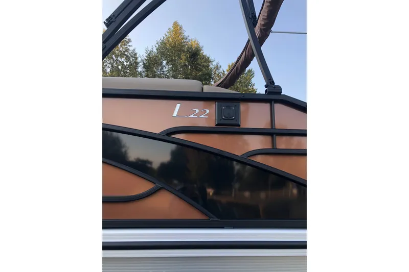 Slide: The Image of 2023 Bennington 22 LSB pontoon boat with sleek design and modern features. - 6