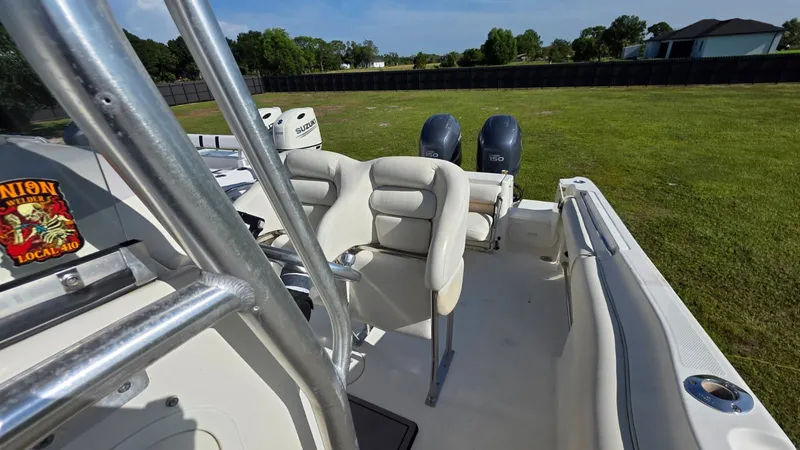 Slide: The Image of The image shows a 2006 Hydra-Sports 2500 CC boat with two outboard engines. - 14