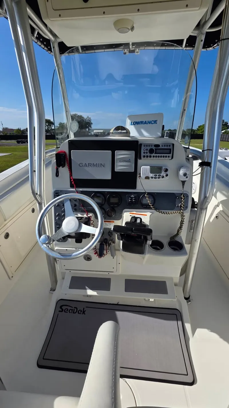 Slide: The Image of The image shows the helm of a 2006 Hydra-Sports 2500 CC boat with Garmin and Lowrance equipment. - 7