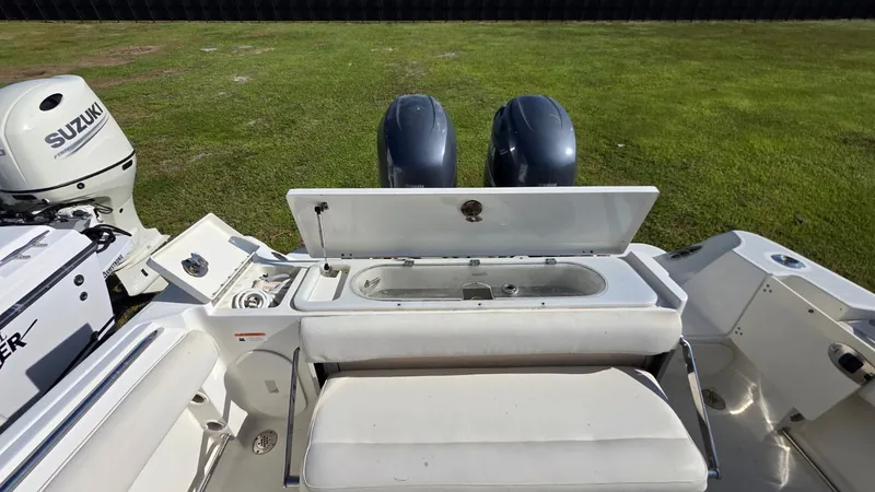 Slide: The Image of The image shows the stern of a 2006 Hydra-Sports 2500 CC boat with two outboard engines. - 15