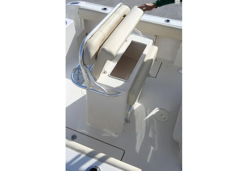 Slide: The Image of Manufacturer Provided Image: 2016 Cobia 237 Center Console boat interior with cushioned seating and storage. - 10