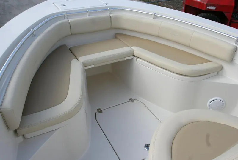 Slide: The Image of Manufacturer Provided Image: 2016 Cobia 237 Center Console boat with beige cushioned seating area. - 7