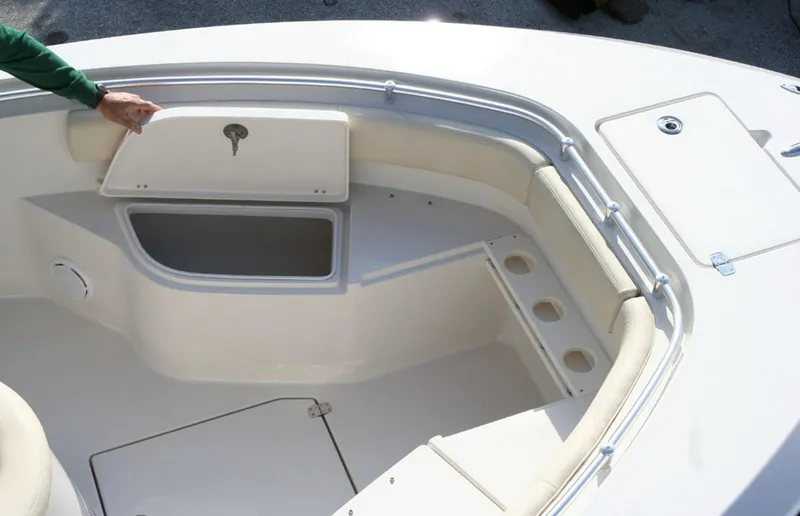 Slide: The Image of Manufacturer Provided Image: 2016 Cobia 237 Center Console boat interior with storage compartments and seating. - 8