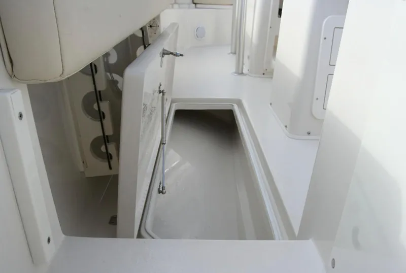 Slide: The Image of Manufacturer Provided Image: 2016 Cobia 237 Center Console storage compartment. - 13