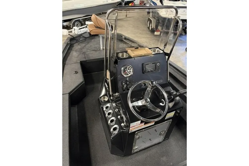Slide: The Image of 2027 Xpress H20 Bay boat console with steering wheel and control panel. - 11