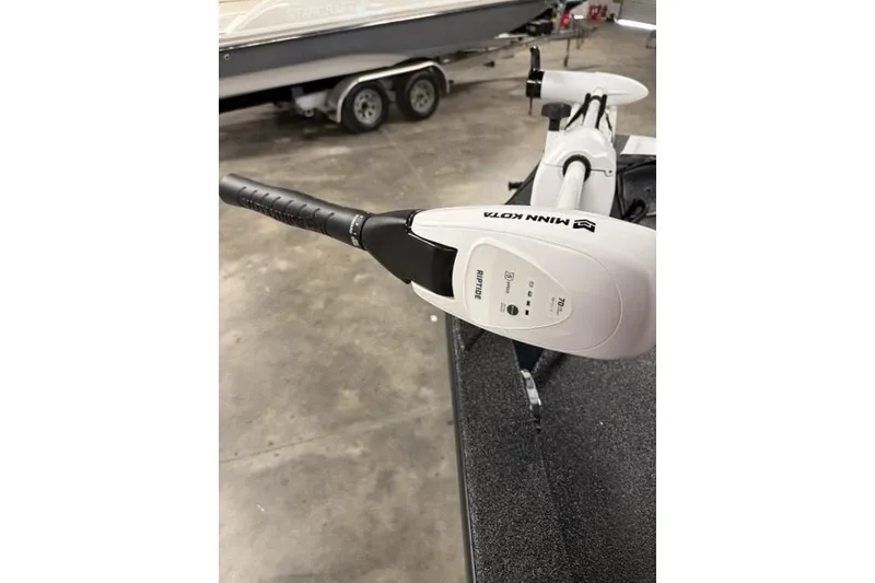 Slide: The Image of Minn Kota Riptide trolling motor on 2027 Xpress H20 Bay boat in garage. - 7