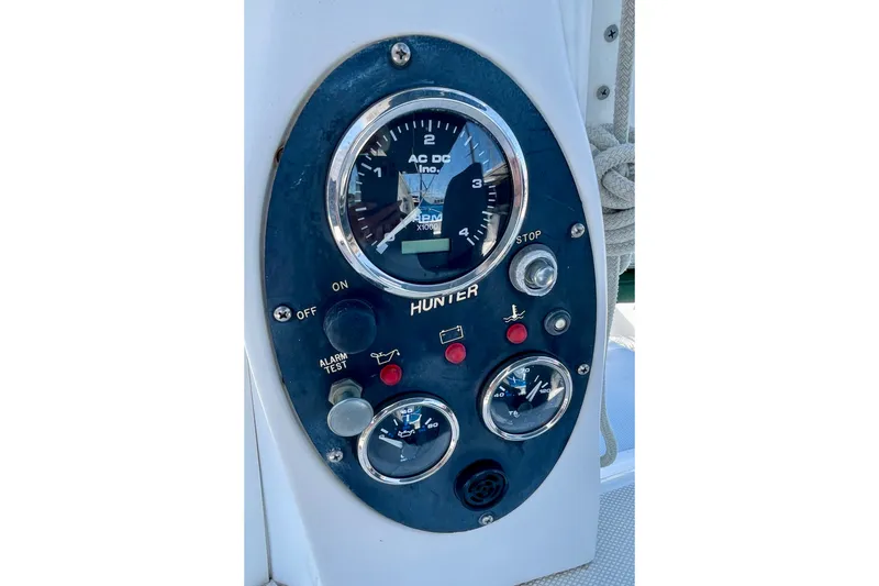 Slide: The Image of Control panel of a 1999 Hunter Passage 420 sailboat with gauges and switches. - 18