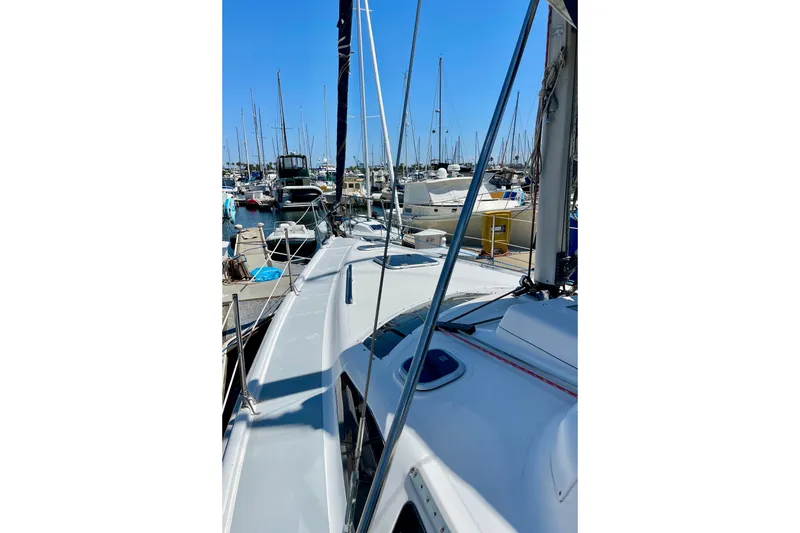 Slide: The Image of Hunter Passage 420 sailboat, 1999 model, docked in a marina under clear blue skies. - 5