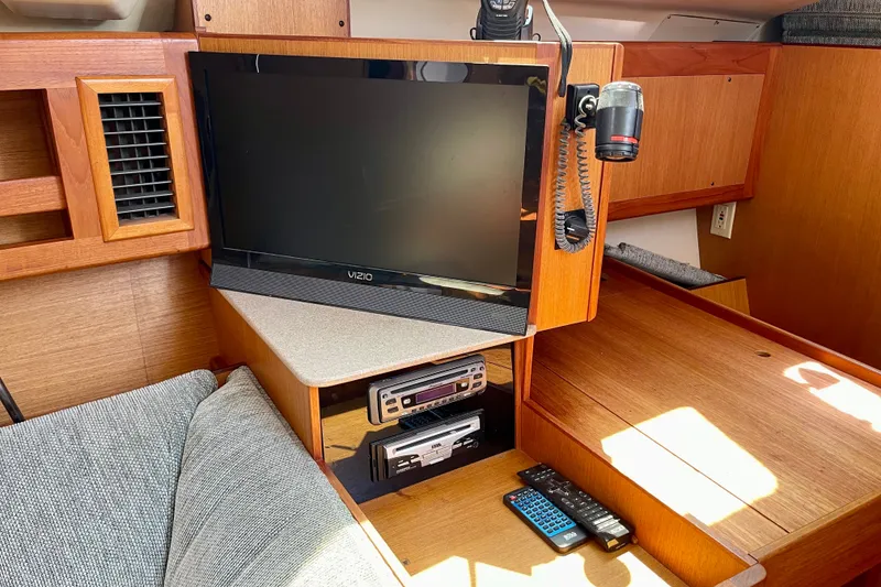 Slide: The Image of Interior of 1999 Hunter Passage 420 yacht with TV and communication equipment. - 34