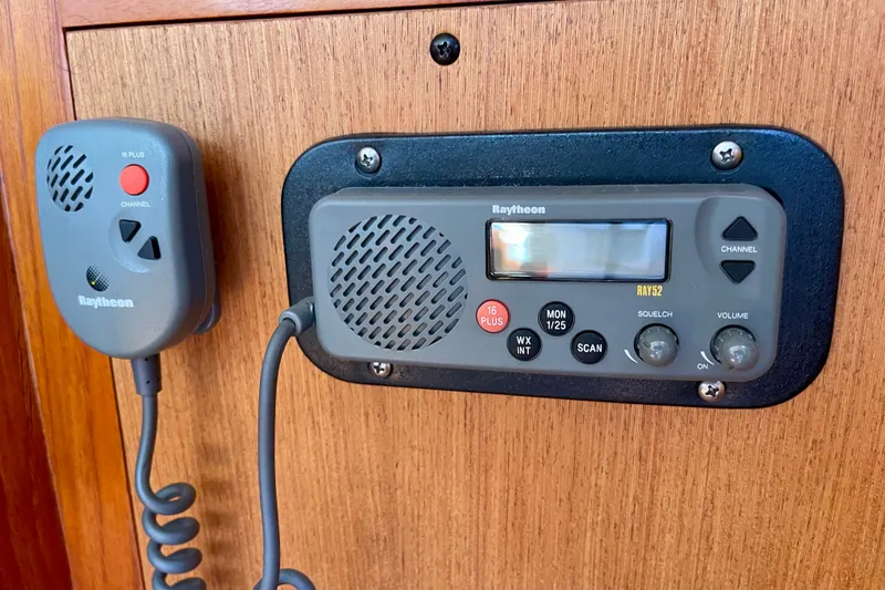 Slide: The Image of Raytheon marine radio on 1999 Hunter Passage 420 sailboat, mounted on wooden panel. - 36