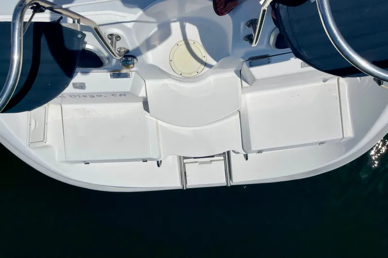 Slide: The Image of 1999 Hunter Passage 420 boat deck with stainless steel railings and seating area. - 14