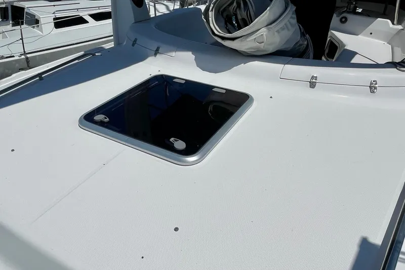 Slide: The Image of Deck of 1999 Hunter Passage 420 sailboat with hatch and coiled sail. - 15