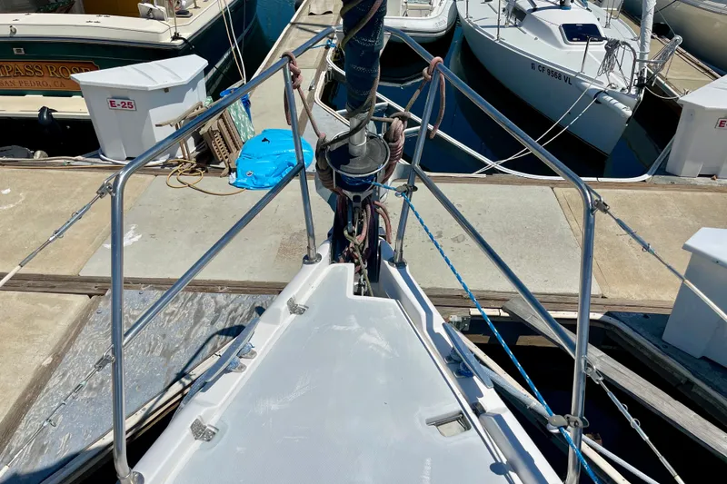 Slide: The Image of Bow view of 1999 Hunter Passage 420 sailboat docked at marina. - 8