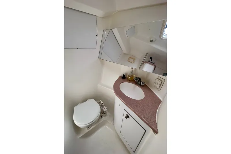 Slide: The Image of Bathroom interior of 1999 Hunter Passage 420 yacht, featuring sink and toilet. - 47