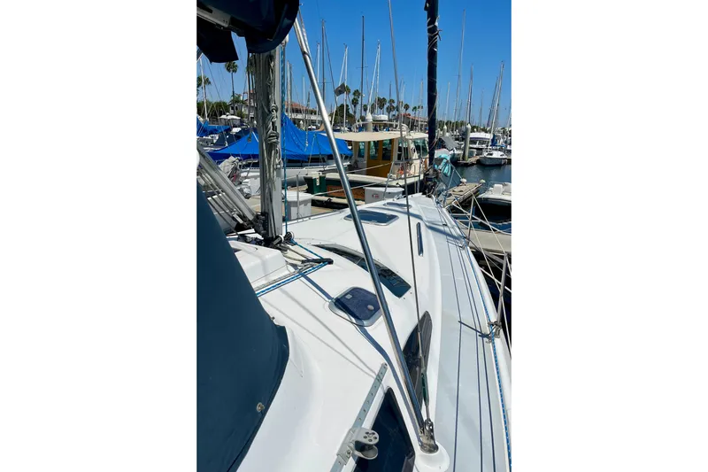 Slide: The Image of Sailboat Hunter Passage 420, 1999 model, docked in a marina under clear blue skies. - 6