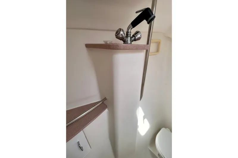 Slide: The Image of Bathroom interior of 1999 Hunter Passage 420 yacht with sink and toilet. - 48