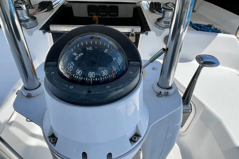 Slide: The Image of Compass on 1999 Hunter Passage 420 sailboat cockpit, featuring navigation equipment. - 20