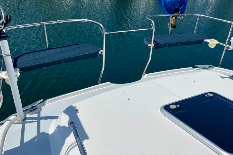 Slide: The Image of Deck view of 1999 Hunter Passage 420 sailboat with blue water backdrop. - 12