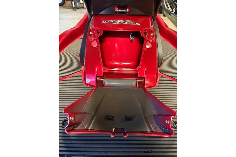 Slide: The Image of 2014 Yamaha WaveRunner FX Cruiser HO, red storage compartment open on a striped floor. - 5