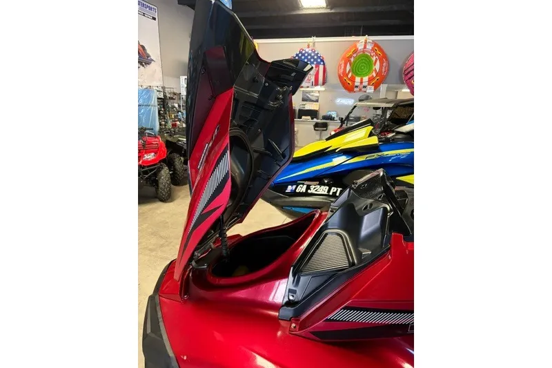 Slide: The Image of 2014 Yamaha WaveRunner FX Cruiser HO with open storage compartment in showroom. - 9