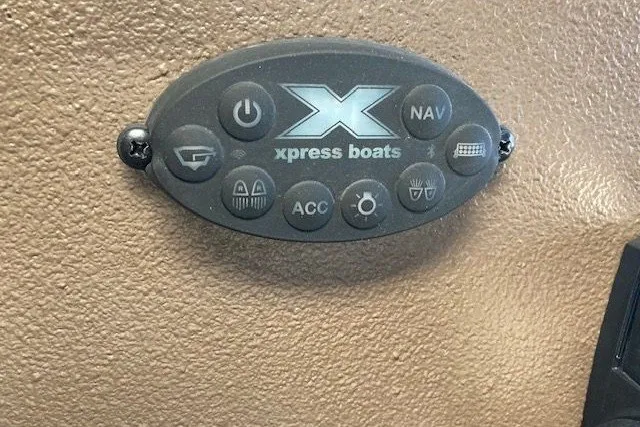 Slide: The Image of Control panel of 2026 Xpress Bayou 180CC boat with various function buttons. - 8