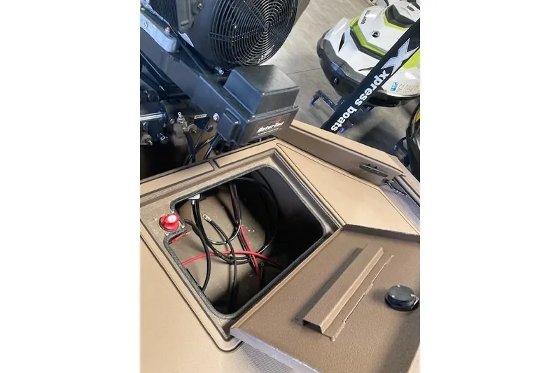 Slide: The Image of 2026 Xpress Bayou 180CC boat interior showing wiring and storage compartment. - 12