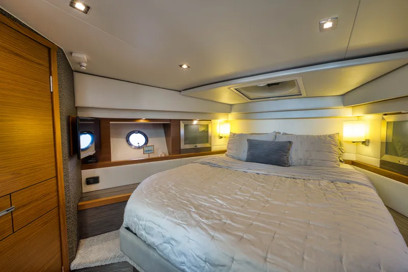 Slide: The Image of Luxurious bedroom interior of 2019 Tiara Yachts C44 Coupe with elegant lighting and modern design. - 25