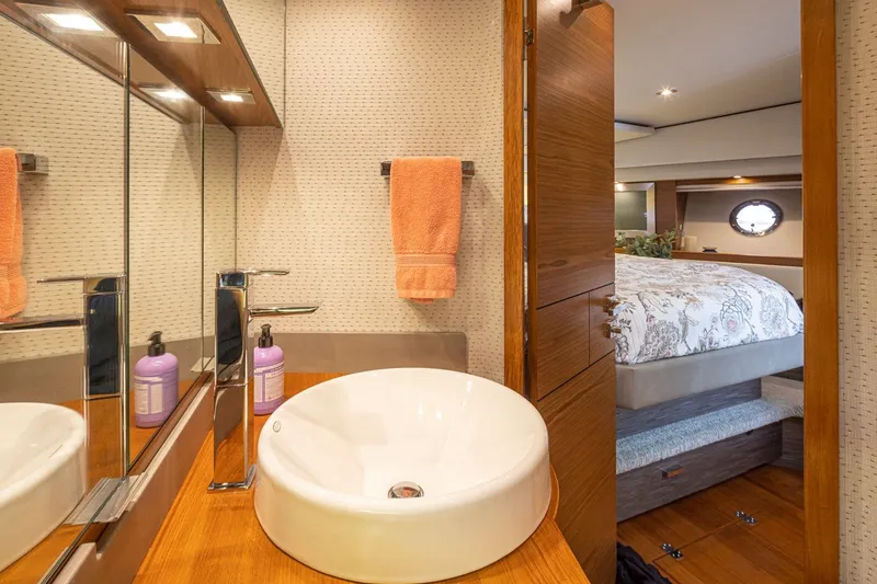 Slide: The Image of Luxurious bathroom and bedroom interior of 2019 Tiara Yachts C44 Coupe. - 20