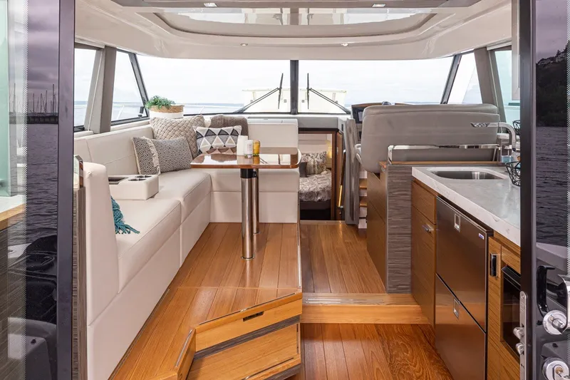 Slide: The Image of Luxurious interior of 2019 Tiara Yachts C44 Coupe with elegant seating and modern kitchen. - 5
