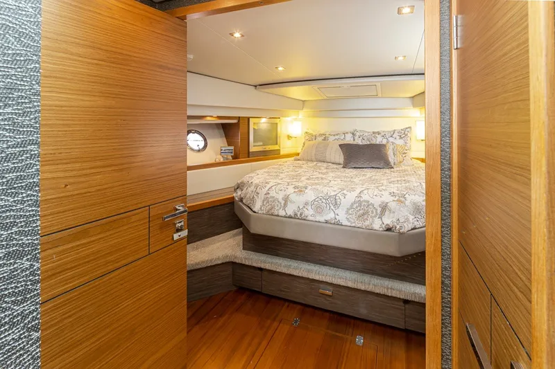 Slide: The Image of Luxurious bedroom interior of 2019 Tiara Yachts C44 Coupe with elegant wood finishes. - 16