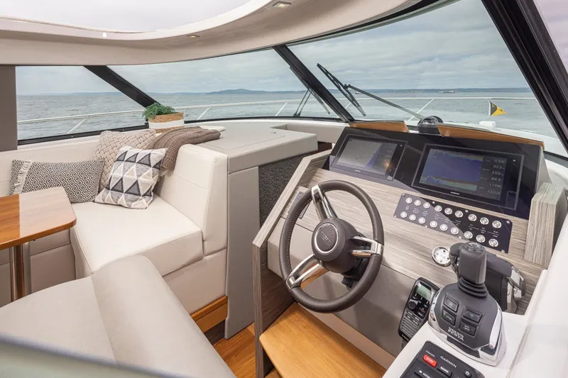 Slide: The Image of Interior of 2019 Tiara Yachts C44 Coupe with modern helm and seating area. - 10