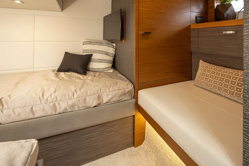 Slide: The Image of Luxurious interior cabin of 2019 Tiara Yachts C44 Coupe with cozy bedding and modern decor. - 24