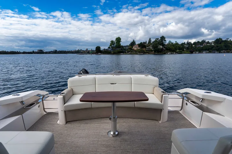 Slide: The Image of 2019 Tiara Yachts C44 Coupe, elegant seating area overlooking serene waters. - 47