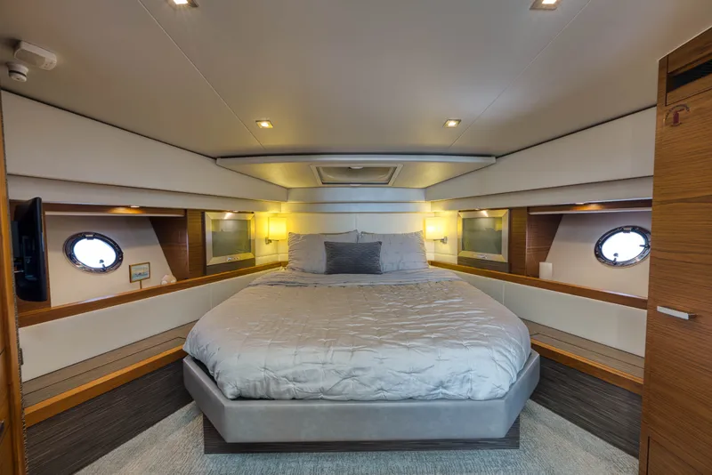 Slide: The Image of Luxurious bedroom interior of 2019 Tiara Yachts C44 Coupe with modern design and cozy ambiance. - 26